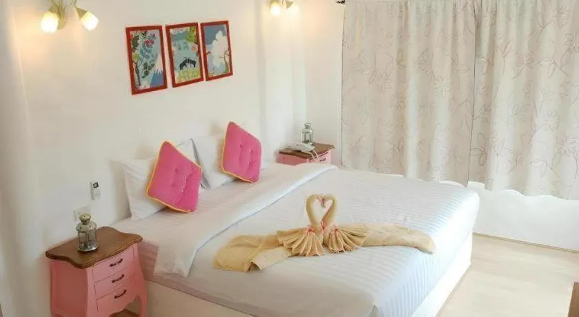 Bed in Rak Na Suan Pueng Resort