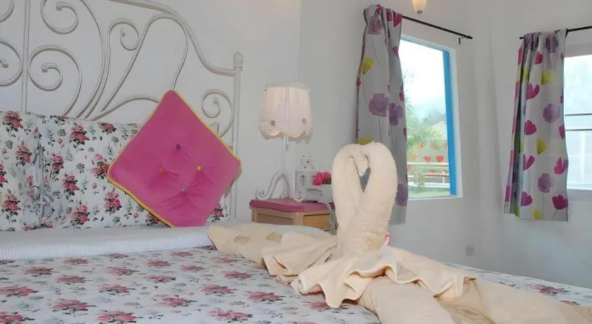 Bed in Rak Na Suan Pueng Resort