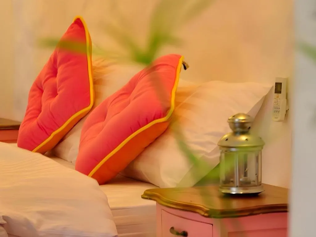 Bed in Rak Na Suan Pueng Resort