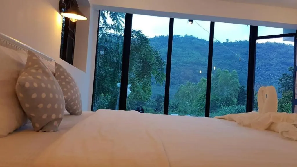 Bed in Rak Na Suan Pueng Resort