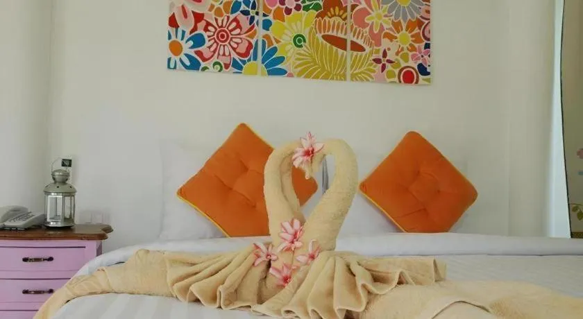 Bed in Rak Na Suan Pueng Resort