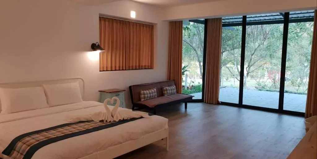 Bed in Rak Na Suan Pueng Resort