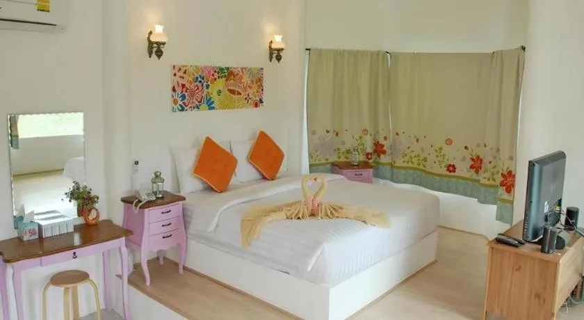 Bed in Rak Na Suan Pueng Resort
