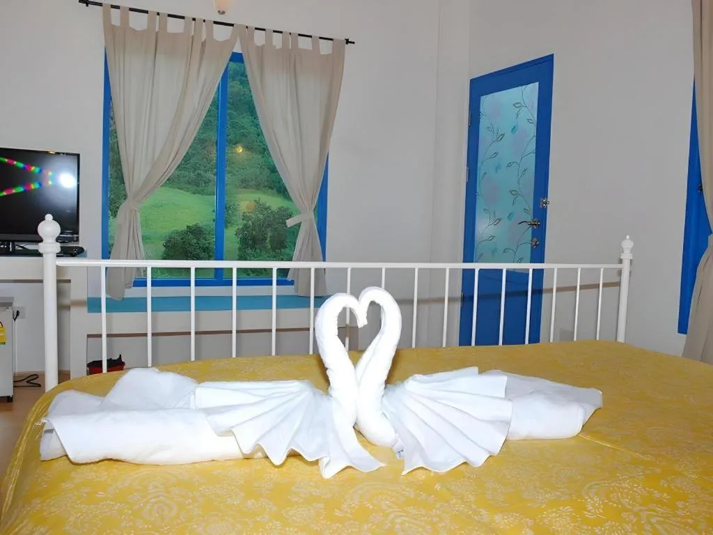 Bed in Rak Na Suan Pueng Resort