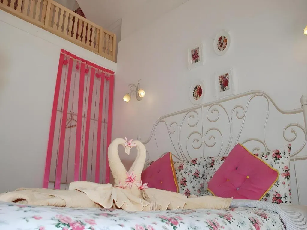 Bed in Rak Na Suan Pueng Resort