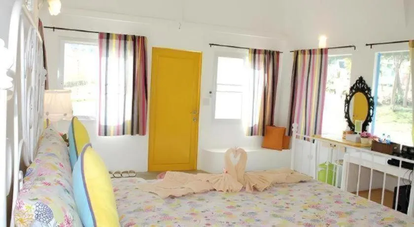Bed in Rak Na Suan Pueng Resort