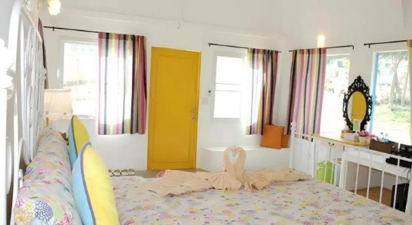 Bed in Rak Na Suan Pueng Resort