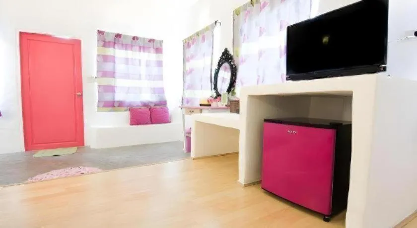 Bed in Rak Na Suan Pueng Resort