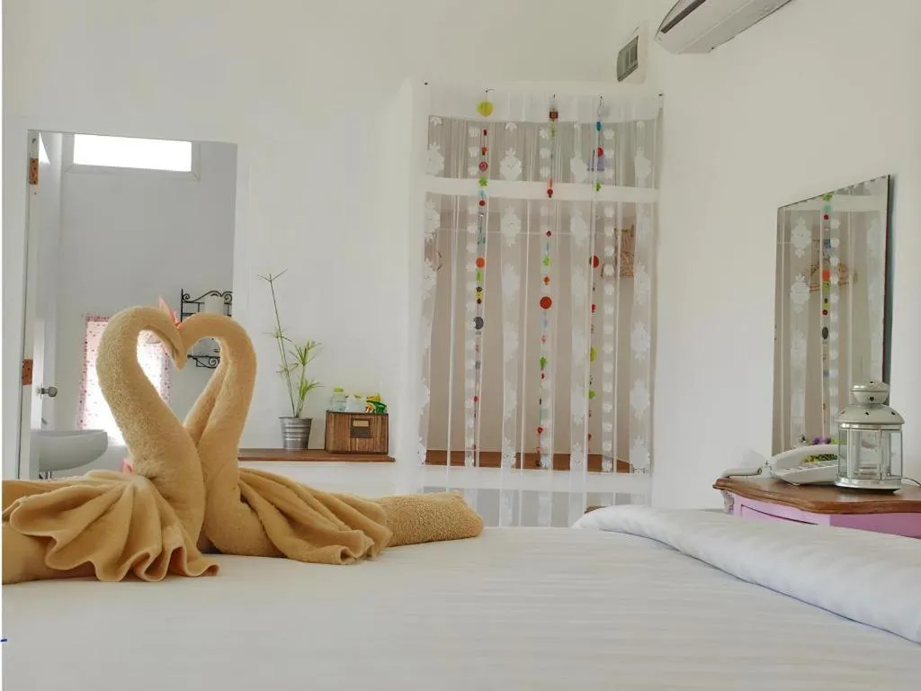 Bed in Rak Na Suan Pueng Resort