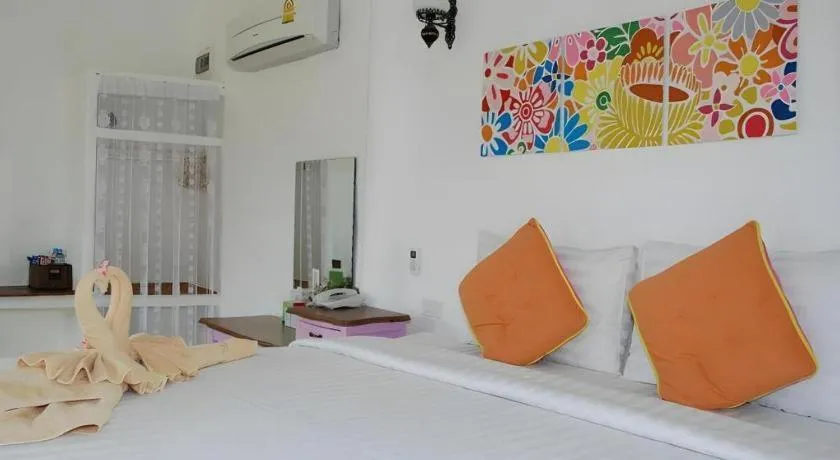 Bed in Rak Na Suan Pueng Resort