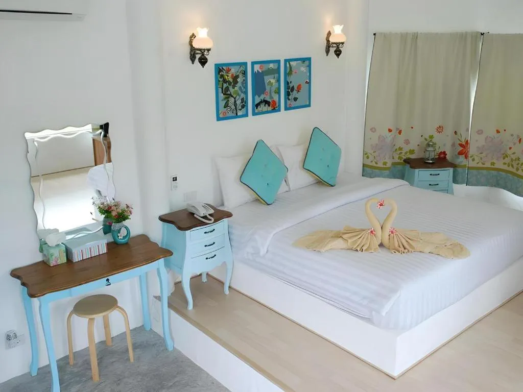 Bed in Rak Na Suan Pueng Resort