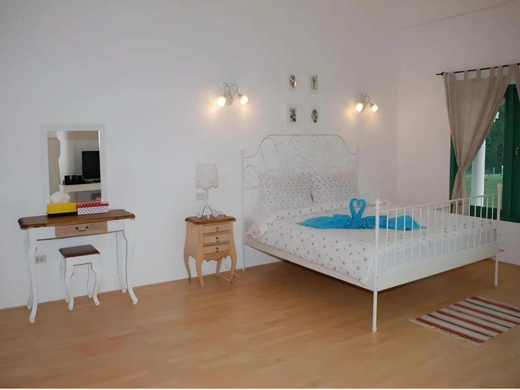 Bed in Rak Na Suan Pueng Resort