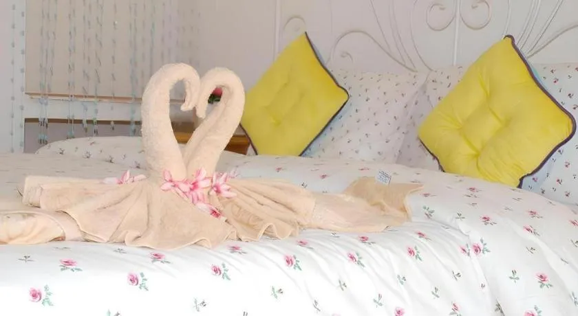 Bed in Rak Na Suan Pueng Resort