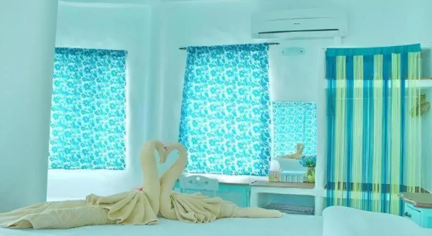 Bed in Rak Na Suan Pueng Resort