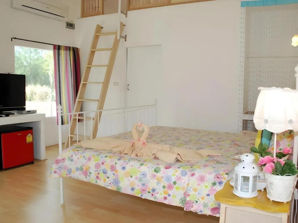 Bed in Rak Na Suan Pueng Resort