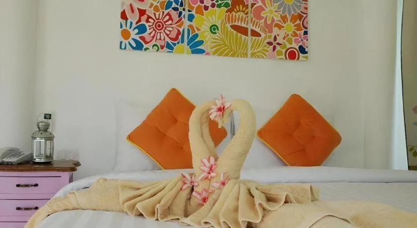 Bed in Rak Na Suan Pueng Resort