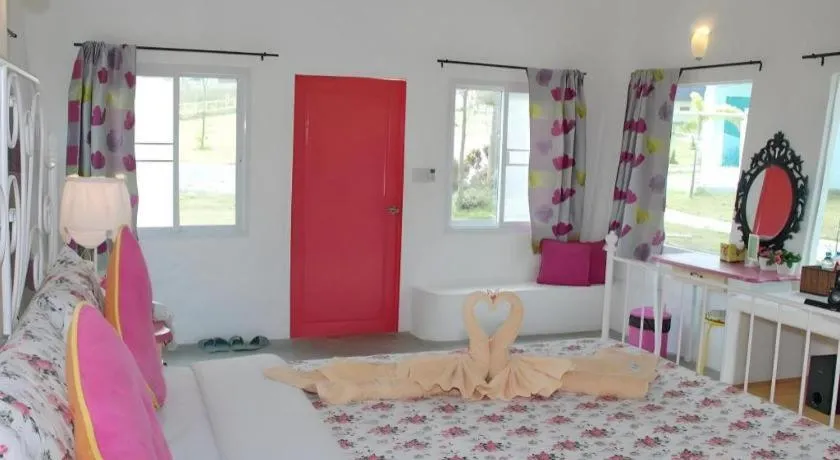 Bed in Rak Na Suan Pueng Resort