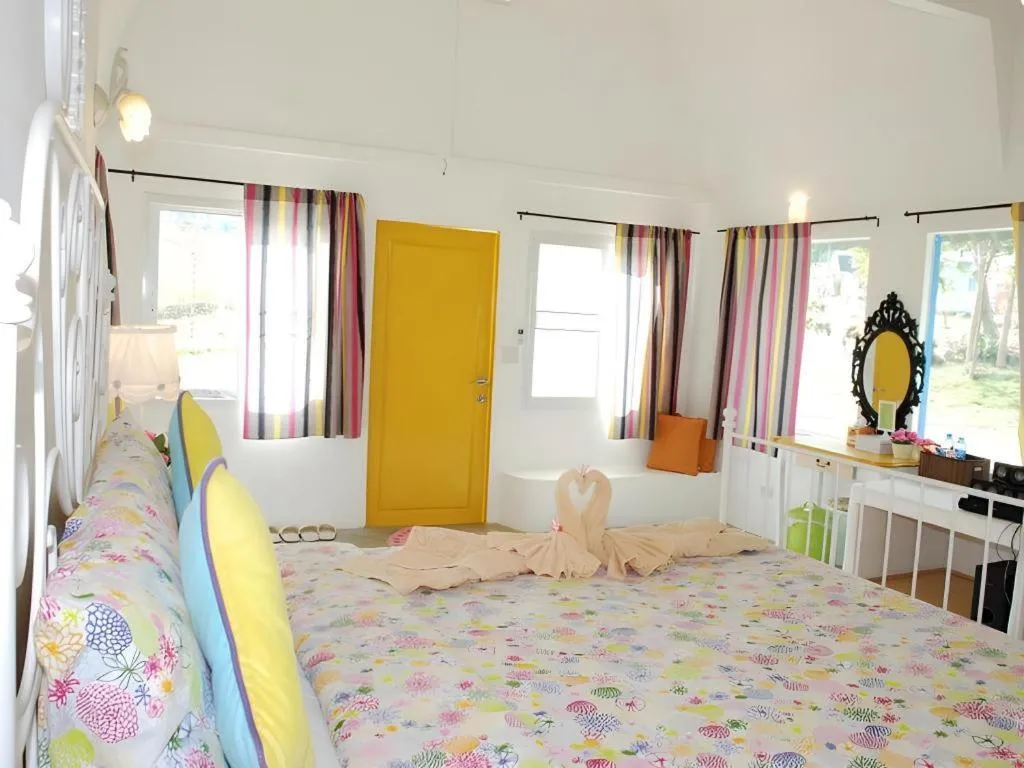 Bed in Rak Na Suan Pueng Resort