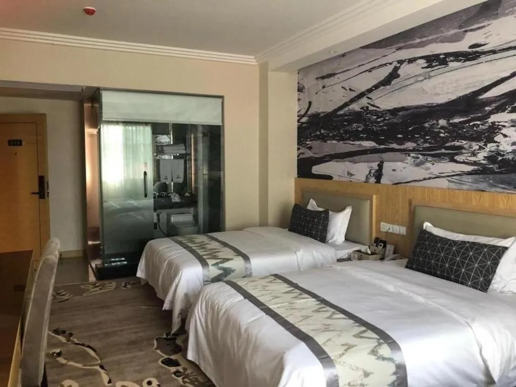 Bed in ST. MORITZ BUSINESS HOTEL