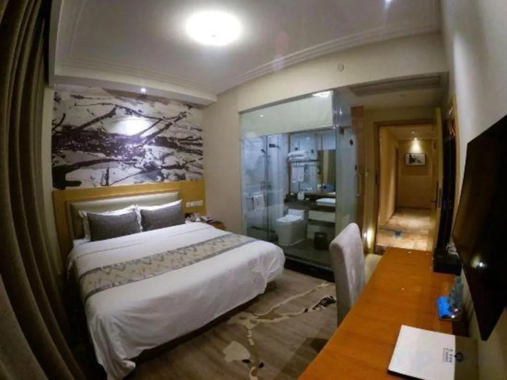 Bed in ST. MORITZ BUSINESS HOTEL