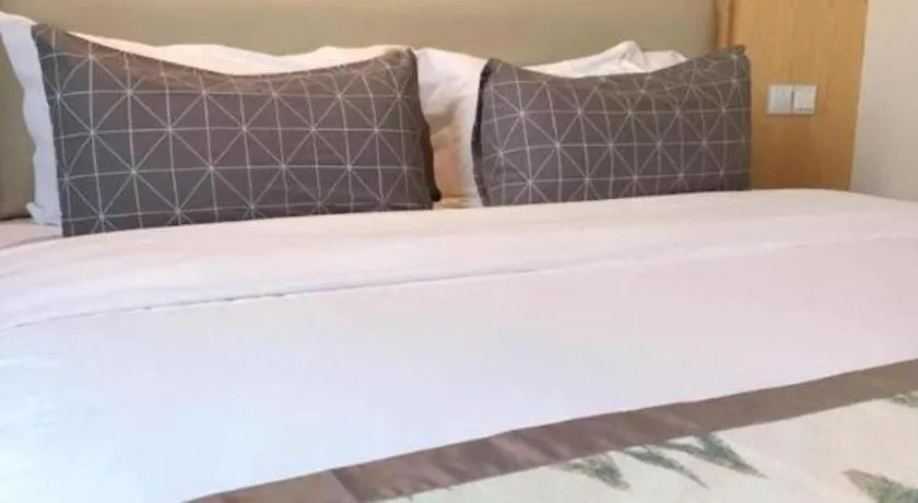 Bed in ST. MORITZ BUSINESS HOTEL