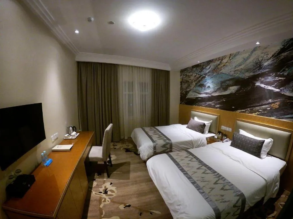 Bed in ST. MORITZ BUSINESS HOTEL