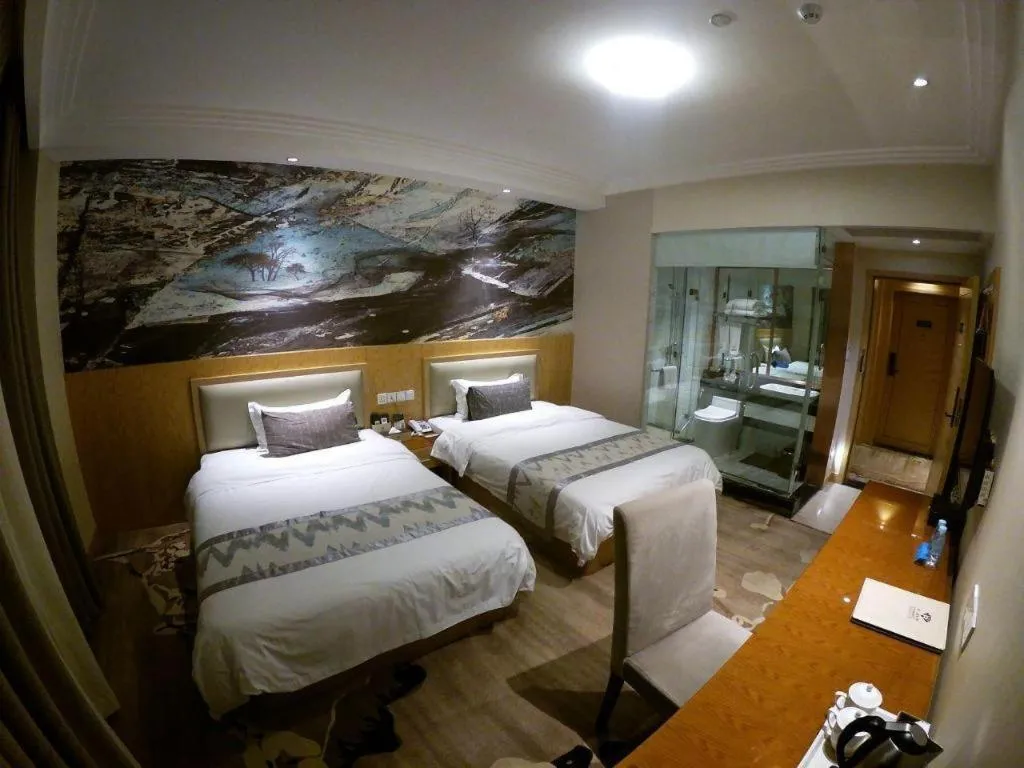 Bed in ST. MORITZ BUSINESS HOTEL