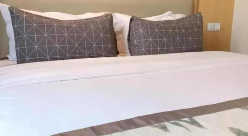 Bed in ST. MORITZ BUSINESS HOTEL