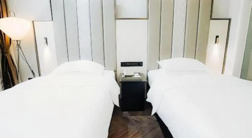 Bed in Jinjiang Metropolo Hotel Nanjing Jiangning Binjiang Development Zone