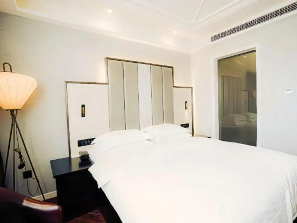 Bed in Jinjiang Metropolo Hotel Nanjing Jiangning Binjiang Development Zone