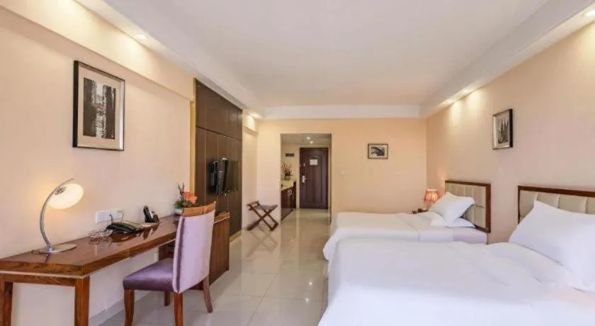 Bed in Foshan Baolong Hotel