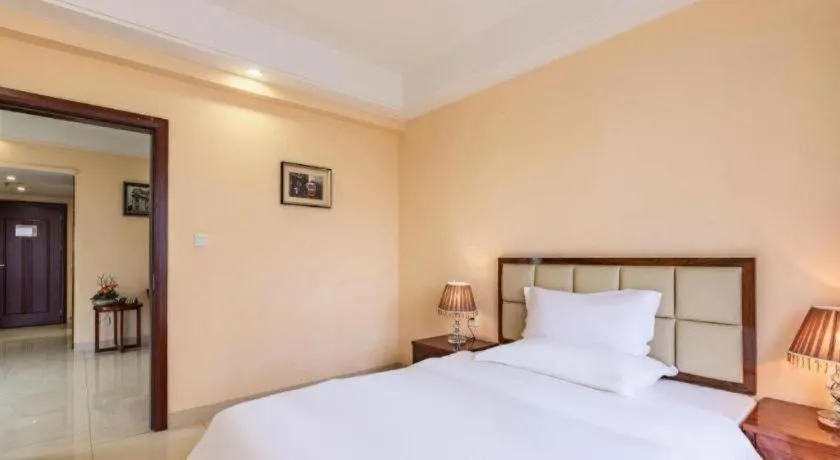 Bed in Foshan Baolong Hotel