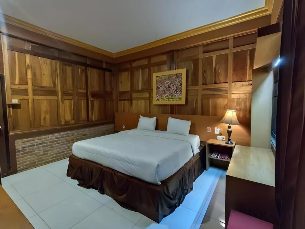 Bed in Parai Beach Resort Telengria