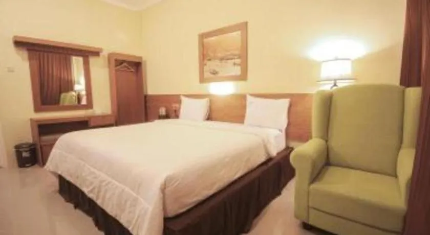 Bed in Parai Beach Resort Telengria