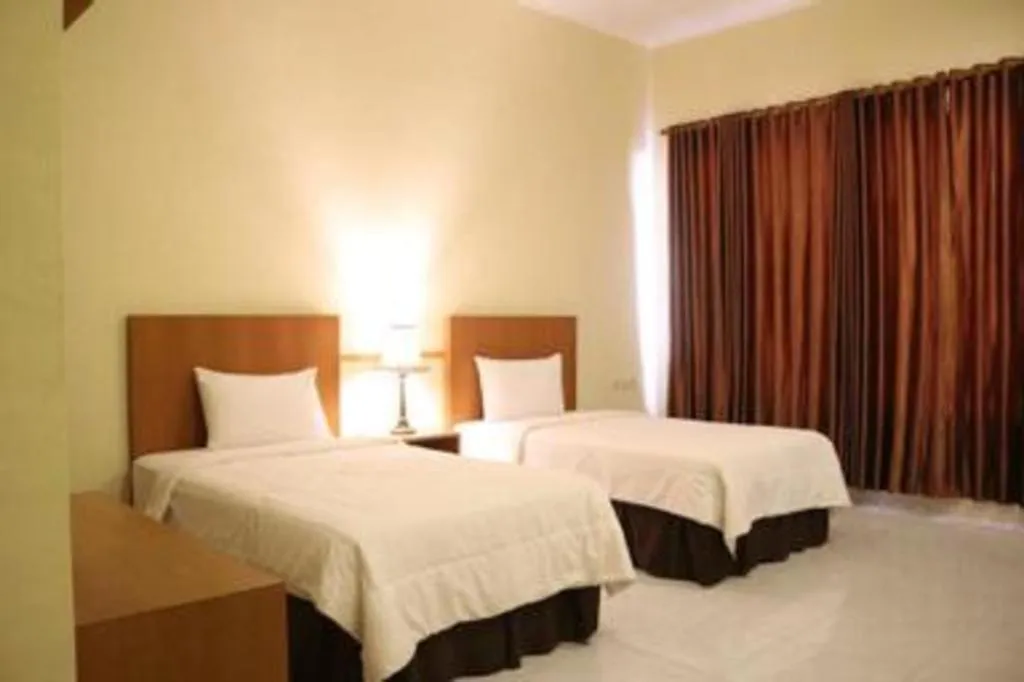 Bed in Parai Beach Resort Telengria