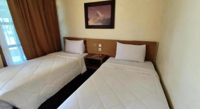Bed in Parai Beach Resort Telengria