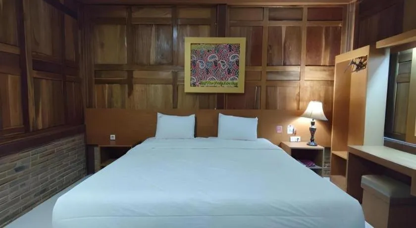 Bed in Parai Beach Resort Telengria