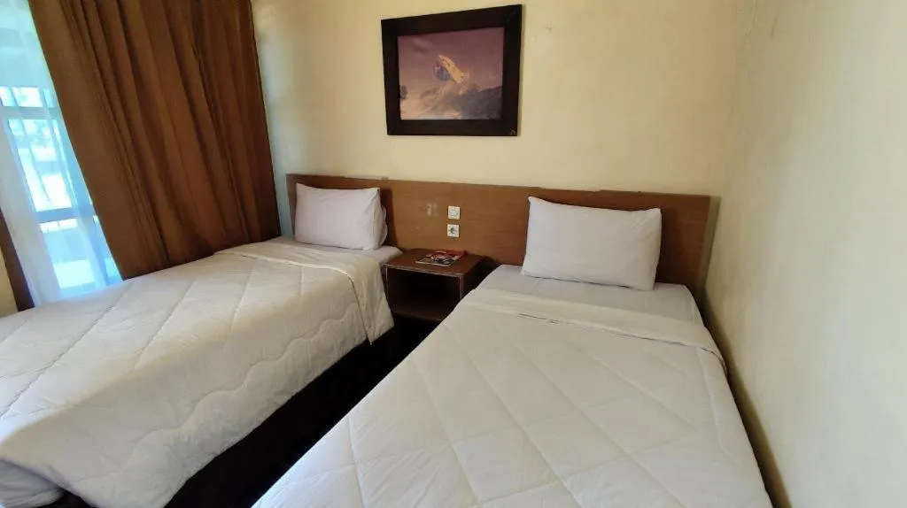 Bed in Parai Beach Resort Telengria