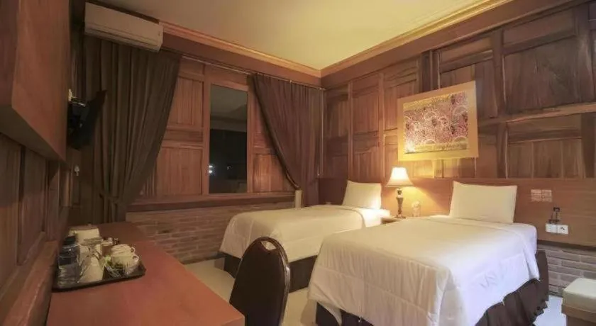 Bed in Parai Beach Resort Telengria