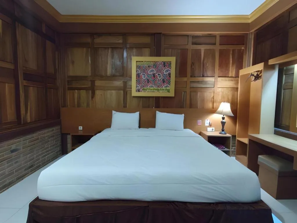 Bed in Parai Beach Resort Telengria