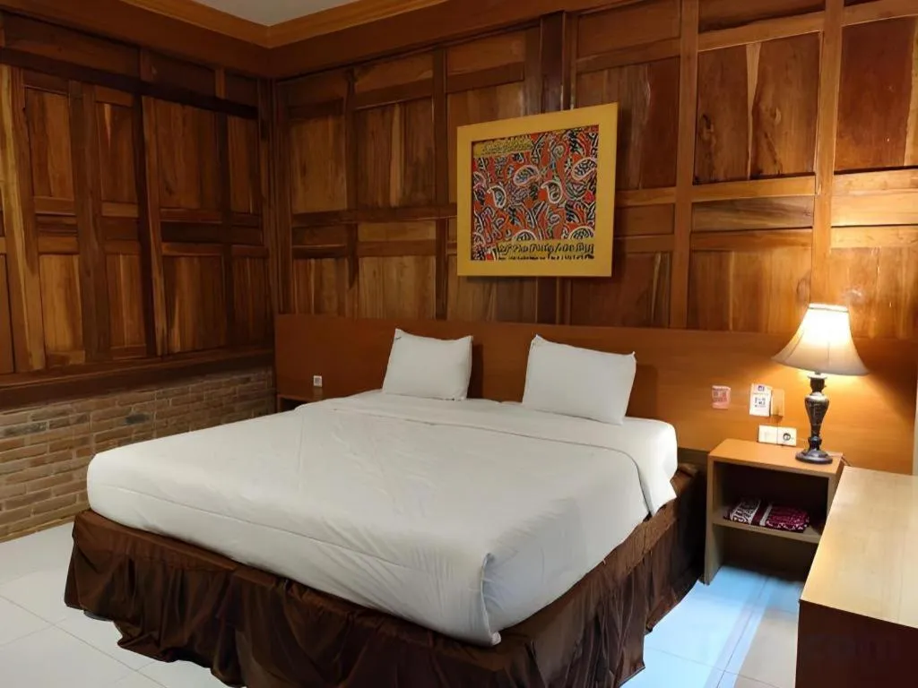 Bed in Parai Beach Resort Telengria