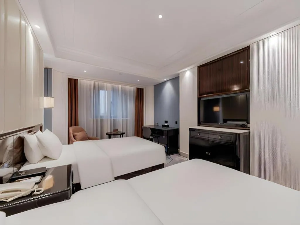 Bed in Jinjiang Metropolo Hotel Nanjing Confucius Temple Branch