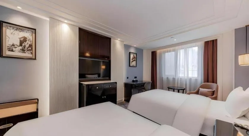 Bed in Jinjiang Metropolo Hotel Nanjing Confucius Temple Branch