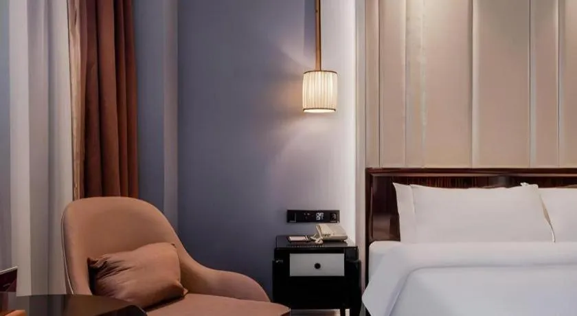 Bed in Jinjiang Metropolo Hotel Nanjing Confucius Temple Branch