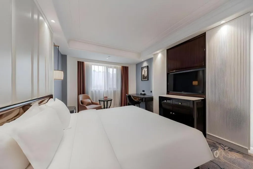 Bed in Jinjiang Metropolo Hotel Nanjing Confucius Temple Branch