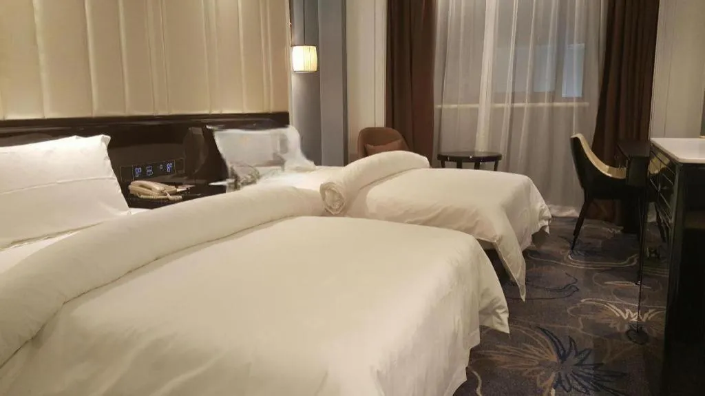 Bed in Jinjiang Metropolo Hotel Nanjing Confucius Temple Branch