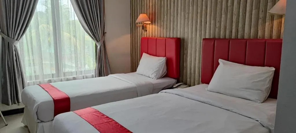 Bed in Queen City Hotel