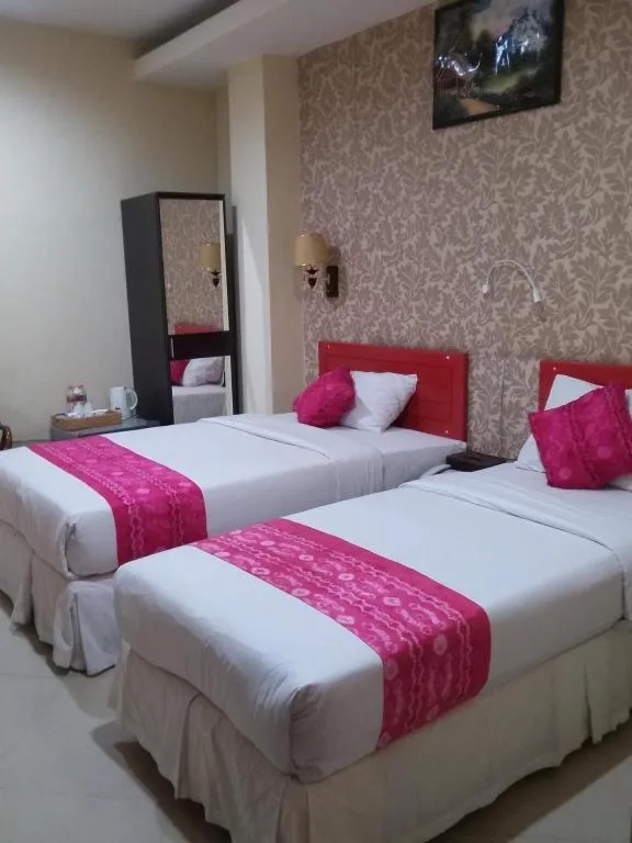 Bed in Queen City Hotel