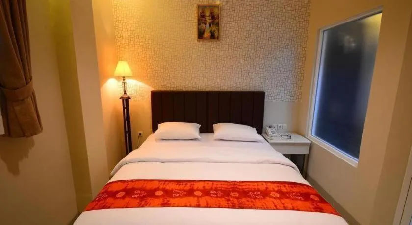 Bed in Queen City Hotel