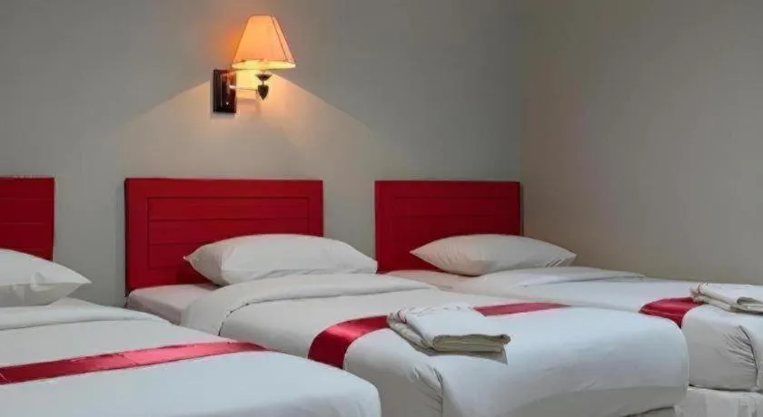 Bed in Queen City Hotel